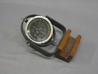 A WWII aircraft compass marked Type 81M No.157880 DC now mounted on a binnacle 