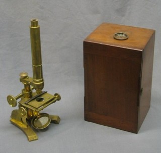 A 19th Century brass single pillar microscope by R Field & Sons Birmingham, together with 1 spare lens and original wooden travelling box