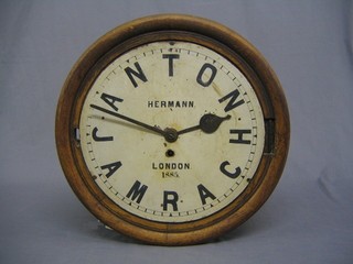A fusee wall clock contained in an oak case, 12" circular dial marked Herman London 1885, the numerals in the form of Anton Jamrach, contained in an oak case (missing bezel)