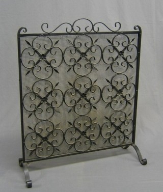 A Blacksmiths made wrought iron and mesh spark guard, 24"