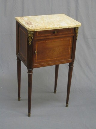 A 19th/20th Century French inlaid mahogany bedside cabinet with white veined marble top, the base fitted a drawer and cupboard enclosed by a panelled door, raised on turned supports 18"