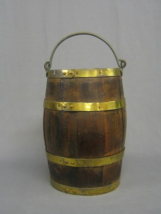 A coopered and brass banded barrel (1 panel cracked)