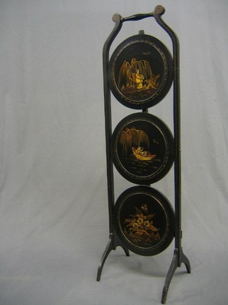 An Art Deco chinoiserie style black lacquered 3 tier folding cake stand