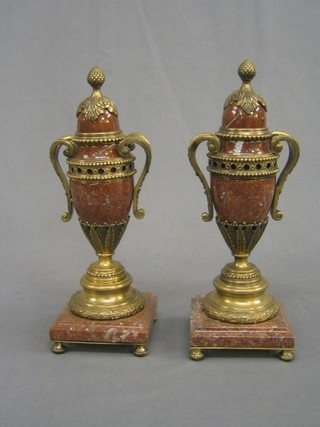 A handsome pair of 20th Century granite and gilt metal mounted urns and covers, raised on square bases 13"