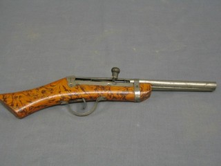 A 19th Century double barrelled childs air pistol