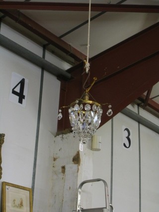 A gilt metal and cut glass lozenge shaped light fitting