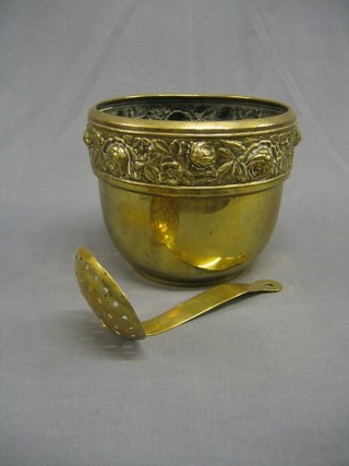 A brass straining spoon and a circular embossed brass jardiniere 10"