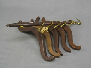5 Victorian mahogany and brass clothes hangers and matching hanging rail