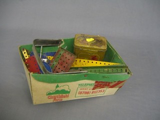 A small collection of green, red and yellow Meccano