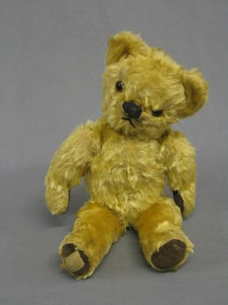 A yellow teddybear with articulated limbs 17"