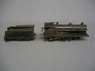 A clock work locomotive George V in black livery complete with tender (contact marks, plastic wheels)