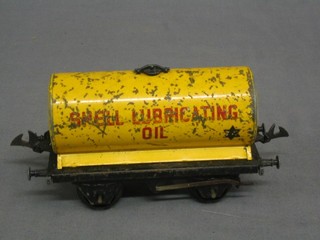 A Hornby O gauge Shell Lubricating oil tanker (heavy paint loss, plastic wheels)