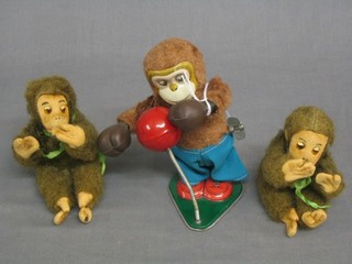 A 1960's tin plate figure of a boxing monkey and 2 seated monkeys