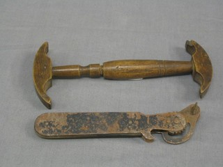 A turned wooden "wig stretcher" together with a  tin opener (2)