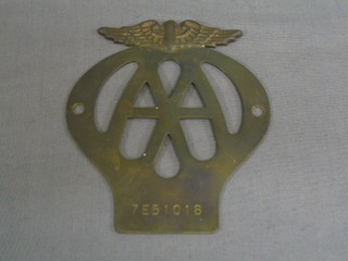 An early pierced brass AA car badge marked 7E5 1018