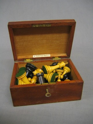 A wooden chess set by Mudie & Sons contained in a wooden box