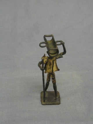 An Eastern bronze figure of a walking man with stick 5"