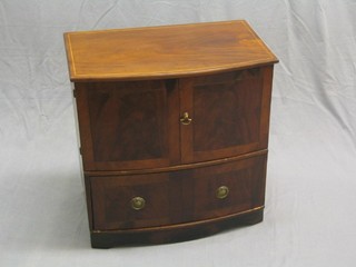 A 19th Century mahogany commode converted for use as a cabinet enclosed by panelled doors the base fitted a drawer, 24"
