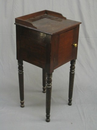 A 19th Century mahogany pot cupboard with three-quarter gallery, raised on turned supports 16"