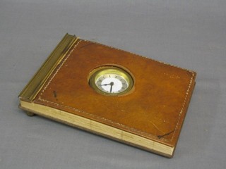 A 1938 American desk diary incorporating a clock contained in a leather and gilt mounted case