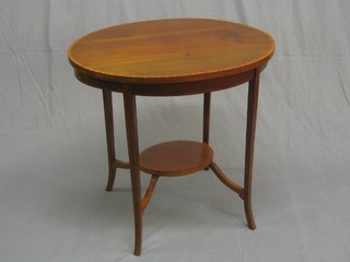 An oval Edwardian inlaid mahogany occasional table with crossbanded top, raised on slender supports and circular undertier 30" (light contact marks to the top)