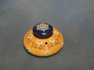 A circular Doulton salt glazed inkwell with 2 pen recepticals, base marked bb, 4"