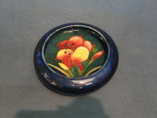 A circular Moorcroft Tulip pattern ashtray, the base impressed Moorcroft 4"
