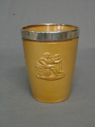 A Victorian circular salt glazed Harvestware beaker with silver rim 5" (cracked)