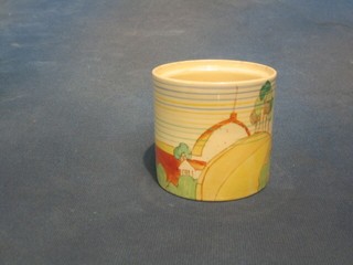 A circular Clarice Cliff preserve jar decorated a house with landscape, 3" (no lid)