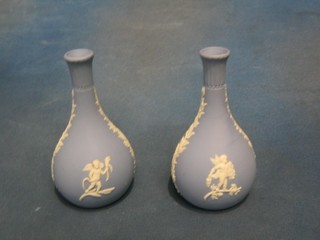 A pair of Wedgwood blue Jasperware club shaped vases, the base marked 99, 6"