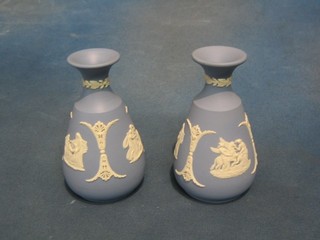 A pair of Wedgwood blue Jasperware club shaped vases, bases marked Wedgwood and incised 65, 5"