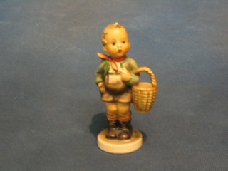 A Hummel figure of a standing boy with basket, 4"