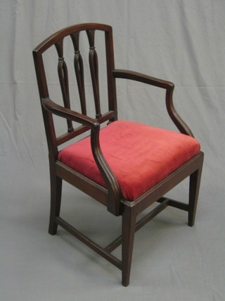 A 19th Century mahogany bar back carver/desk chair with upholstered drop in seat, raised on square tapering supports, united by an H framed stretcher