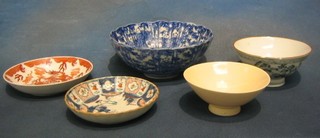 An Oriental yellow glazed bowl, 5", do. blue and white bowl 5", a large blue and white bowl 10" and 2 Oriental saucers