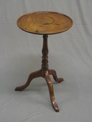 A 19th Century circular dish top wine table, raised on pillar and tripod supports 18" (top with old water ring and stain)