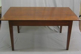 A hardwood farm house table, raised on square tapering supports 63"