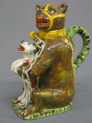 A reproduction 18th/19th Century  Staffordshire jug in the form of a chained and muzzled bear with standing dog 12"