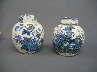 A large pair of 19th Century Masons blue and white floral patterned ginger jars and covers 10", bases with blue Masons mark