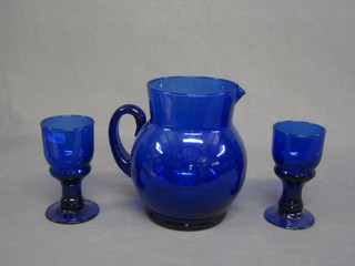 A Bristol blue glass jug 8" together with 2 Bristol blue glass goblets
