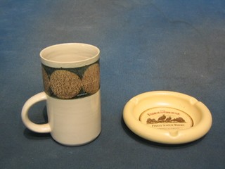 A Troika coffee mug, base marked Troika St Ives England and a circular Wade Famous Grouse ashtray 5"