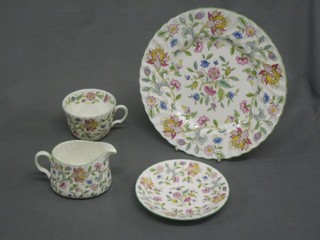 A 29 piece Minton Haddon Hall dinner/tea service comprising 4 dinner plates 10", 8 tea plates 6", 2 breakfast cups and saucers, 4 saucers 6", 4 smaller saucers, 2 cream jugs and a sugar bowl