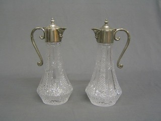 2 moulded glass decanters with silver rims