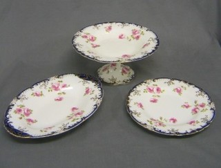 A 13 piece Wedgwood dessert service with gilt and floral decoration with comport and 12 plates decorated roses with gilt banding 9" (banding rubbed in places) purchased at Phillips Ltd Mount St London