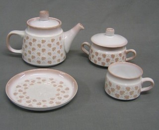 A 24 piece Denby Fallen Leaf Pattern dinner service comprising 2 dinner plates, 4 salad plates, 3 side plates, 2 cups, 4 saucers, teapot, lidded preserve jar and 7 pieces of Denby cutlery