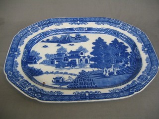 A blue and white transfer decorated meat plate decorated buildings 20"