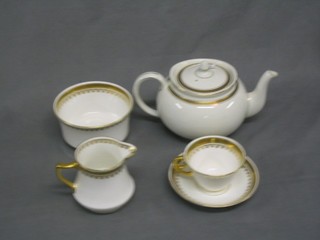 A 40 piece china gilt banded tea/dinner service comprising 2 bread plates 10", 12 tea plates 9", 12 cups and 12 saucers, teapot, cream jug and sugar bowl, 11 tea plates 7", together with 12 Taylor & Kent bone china plates with gilt banding and Grecian Key decoration 7", a 35 piece Ye Olde English Governor china tea service comprising circular twin handled plate, 12 tea plates and 11 cups and 11 saucers all with gilt banding, together with an Elizabethan fine bone china coffee can with floral decoration