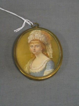 An 18th/19th Century oval watercolour portrait miniature on ivory of a seated bonnetted lady, 3"