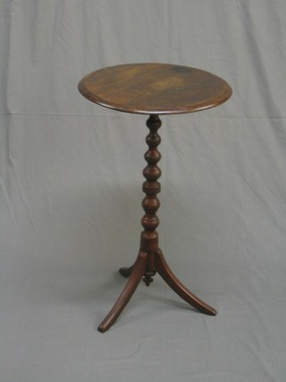 A 19th Century circular mahogany wine table, raised on a bobbin turned column with tripod base 18"