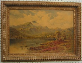 A coloured print "Lake Scene with Mountain in Distance" contained in a carved wooden frame 20" x 28"