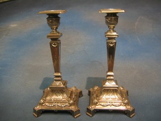 A handsome pair of 19th Century silver plated candlesticks with reeded decoration, 11"